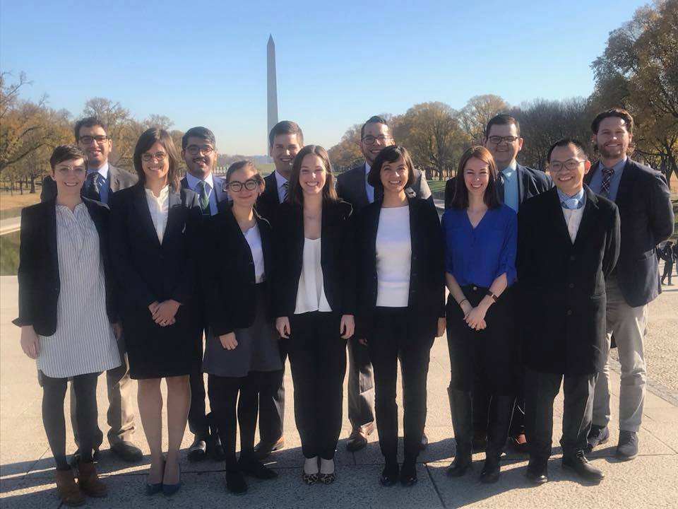 Participants at a graduate recruiting even pose in Washington, DC.