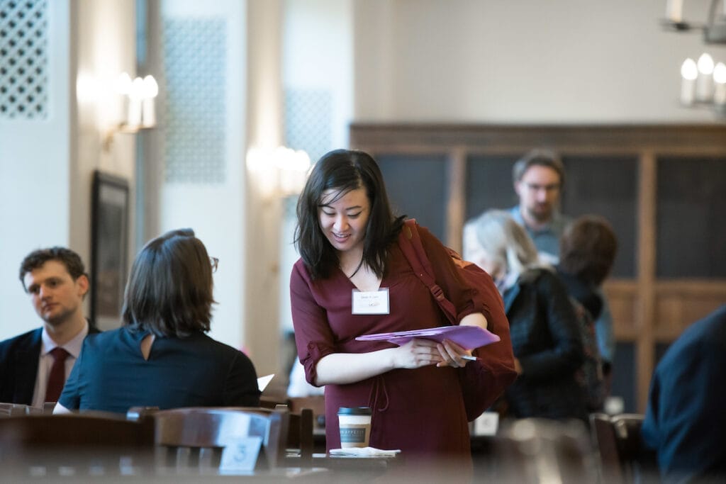 Two people chatting in a conference setting